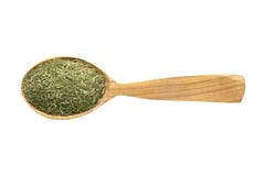 Eneldo secado en la cuchara de madera aislada en el fondo blanco especia para cocinar la comida, visión superior foto de archivo libre de regalías Eneldo secado en la cuchara de madera aislada en el fondo blanco especia para cocinar la comida, visión superior foto de archivo libre de regalías