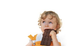 Enfant mignon mangeant du chocolat Photo libre de droits Enfant mignon mangeant du chocolat Photo libre de droits