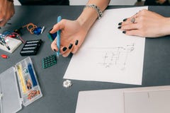 Engineer drawing scheme of electronic construction stock photos Engineer drawing scheme of electronic construction stock photos