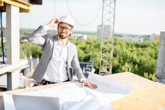 Engineer with drawings on the structure stock images Engineer with drawings on the structure stock images