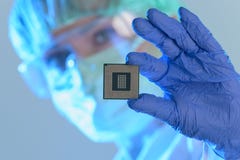 The engineer holds a processor in hands Stock Images The engineer holds a processor in hands Stock Images