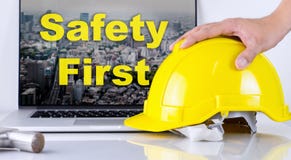 Engineer is picking up safety helmet for Safety First Stock Photography Engineer is picking up safety helmet for Safety First Stock Photography