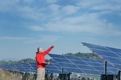 Engineer Using Laptop At Solar Panels Plant Field Stock Photography Engineer Using Laptop At Solar Panels Plant Field Stock Photography