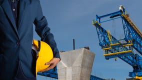 Engineer or worker hold yellow helmet for workers security stock photography Engineer or worker hold yellow helmet for workers security stock photography