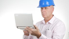 Engineer Working Using a Laptop Accessing on Line Technical Information royalty free stock photography Engineer Working Using a Laptop Accessing on Line Technical Information royalty free stock photography