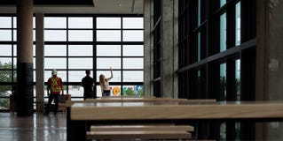 Engineers And Workman In Modern Food Court With Windows Royalty Free Stock Images Engineers And Workman In Modern Food Court With Windows Royalty Free Stock Images