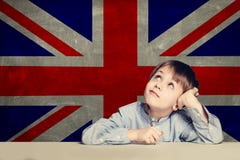English concept with smart kid student against the UK flag background royalty free stock photo English concept with smart kid student against the UK flag background royalty free stock photo
