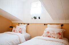 English country vintage attic bedroom interior with natural ligh Royalty Free Stock Image English country vintage attic bedroom interior with natural ligh Royalty Free Stock Image