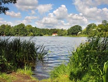 English Lake With House In The Distance Stock Photos English Lake With House In The Distance Stock Photos