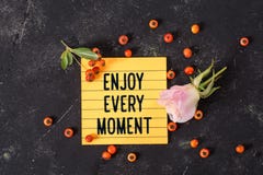 Enjoy every moment text in memo stock image Enjoy every moment text in memo stock image