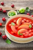 Enjoy your fruit soup with cherries, apples and mint stock images Enjoy your fruit soup with cherries, apples and mint stock images