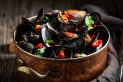 Enjoy your mussels with coriander and chili peppers stock images Enjoy your mussels with coriander and chili peppers stock images
