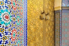 Entrance door with mosiac and brass door at the Royal palace in stock photography Entrance door with mosiac and brass door at the Royal palace in stock photography