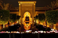 Illuminated oriental style entrance with geometric patterns and water basin of Hotel Mazagan Beach Resort, Morocco. Night shot.