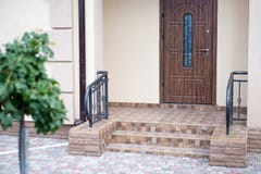 The entrance of a new modern house outside view. Decorated with royalty free stock image The entrance of a new modern house outside view. Decorated with royalty free stock image