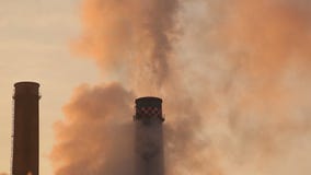 Environment pollution from smoke stacks. Smoke stacks causing environment pollution