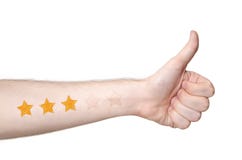 Equipaggia i thmbs della mano su e una valutazione di 3 stelle fotografia stock Equipaggia i thmbs della mano su e una valutazione di 3 stelle fotografia stock