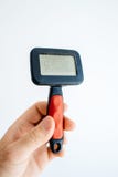 Erntehand, die Haustierbürste hält lizenzfreies stockfoto Erntehand, die Haustierbürste hält lizenzfreies stockfoto