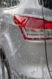 Espuma na parte de trás de um carro imagens de stock Espuma na parte de trás de um carro imagens de stock