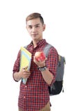 Estudante asiático que está no branco com livros e maçã De volta ao sc imagens de stock Estudante asiático que está no branco com livros e maçã De volta ao sc imagens de stock