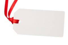 Etiqueta en blanco del regalo con la cinta roja imágenes de archivo libres de regalías Etiqueta en blanco del regalo con la cinta roja imágenes de archivo libres de regalías
