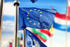 EU flags waving over blue sky. Brussels, Belgium royalty free stock photography EU flags waving over blue sky. Brussels, Belgium royalty free stock photography