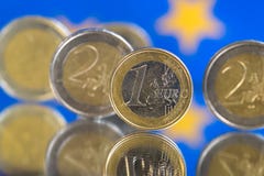 Euro coins on a blue background stock photo Euro coins on a blue background stock photo