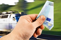 The euro in his hand on a background of train stock photography The euro in his hand on a background of train stock photography