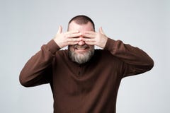 European mature man covering his face by hands royalty free stock images European mature man covering his face by hands royalty free stock images
