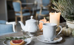 Evening tea with rosemary and grapefruit, by candlelight in a vintage cafe royalty free stock photo Evening tea with rosemary and grapefruit, by candlelight in a vintage cafe royalty free stock photo