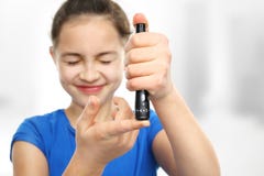 Examine blood sugar levels. Prevention of diabetes in children stock image Examine blood sugar levels. Prevention of diabetes in children stock image