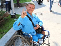 An example of optimism and strength of mind from a disabled person in a wheelchair.