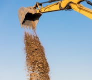 Excavator machine unloading sand at construction site royalty free stock images Excavator machine unloading sand at construction site royalty free stock images