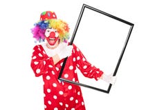 Excited clown holding a big picture frame Royalty Free Stock Image Excited clown holding a big picture frame Royalty Free Stock Image