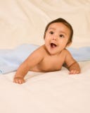 Excited Ethnic Baby Boy Lying Down On Blanket Stock Images Excited Ethnic Baby Boy Lying Down On Blanket Stock Images