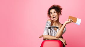 Excited Girl Looking Aside And Holding Tickets stock photos Excited Girl Looking Aside And Holding Tickets stock photos