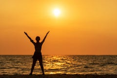 Exercise spirit lifestyle mind woman peace vitality, silhouette outdoors on the Sea sunrise, relax and freedom vital abstract.
