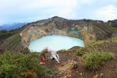 Exercising yoga on Kelimutu royalty free stock photo Exercising yoga on Kelimutu royalty free stock photo