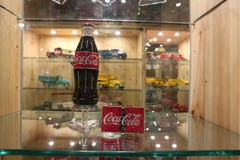 Exhibition dedicated to Coca Cola. A beautiful red Coca Cola bottle royalty free stock photography Exhibition dedicated to Coca Cola. A beautiful red Coca Cola bottle royalty free stock photography