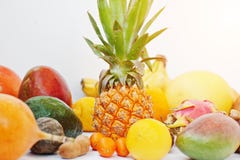 Exotic fruits isolated on white background. Healthy eating dieting food. Pitahaya, carambola, papaya, baby pineapple, mango, pass