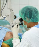 Eye doctor performing operation