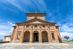 Facade of catholic church under blue sky in Diano d`Alba, Italy.