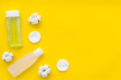 Mycelial water, lotion and cotton pads for skin care on yellow background flat lay space for text royalty free stock image Mycelial water, lotion and cotton pads for skin care on yellow background flat lay space for text royalty free stock image