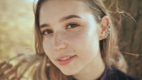 Face close-up of a nice young blonde russian girl. stock footage Face close-up of a nice young blonde russian girl. stock footage