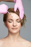 Face needle injection. Young woman cosmetology procedure. Doctor gloves royalty free stock photo Face needle injection. Young woman cosmetology procedure. Doctor gloves royalty free stock photo