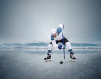 Face-off ice hockey moment on the frozen lake royalty free stock photo Face-off ice hockey moment on the frozen lake royalty free stock photo