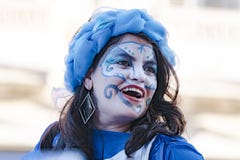 Face painted woman of Cuban street performers dancing on stilts, Havana, Cuba, celebrating the annual carnival festivity. 