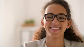 Face of smiling african american woman in glasses