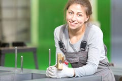 Factory female worker during power transformer magnetic core assembling stock photography Factory female worker during power transformer magnetic core assembling stock photography