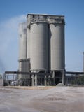 Factory on a sky background. Industrial, modern manufacturing building for dairy production. Factory business concept. stock photo Factory on a sky background. Industrial, modern manufacturing building for dairy production. Factory business concept. stock photo